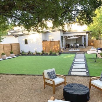 A/T Lawn and Landscape  - Back yard custom turf, poured concrete pavers, stone and customer edging around new flower beds and potted plant areas. - Landscaping Near Me