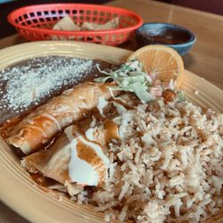 Alcatraz American Food and Taqueria - Combo plate - enchilada & tamale with rice and beans.