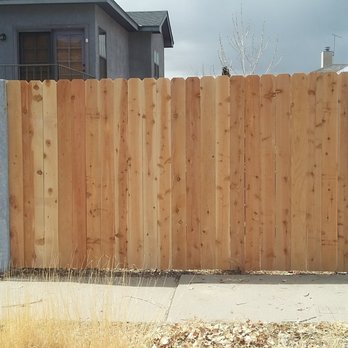 Modern Creation Construction - a wooden fence in front of a house - Handyman Near Me Modern Creation Construction - a wooden fence in front of a house - Handyman Near Me