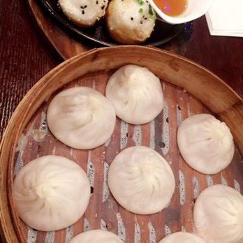 Shanghai Delight - Back: Pan fried pork buns (6 pieces for $8.95) | Front: Pork dumplings (8 pieces for $8.95) - Shanghainese Near Me - Milpitas, California Shanghai Delight - Back: Pan fried pork buns (6 pieces for $8.95) | Front: Pork dumplings (8 pieces for $8.95) - Shanghainese Near Me - Milpitas, California