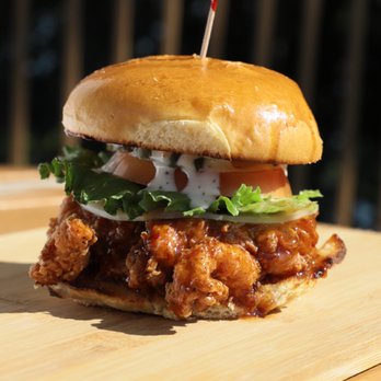 Cabin Lodge Grill - a chicken sandwich on a wooden board - American Near Me - Oakland, Maryland Cabin Lodge Grill - a chicken sandwich on a wooden board - American Near Me - Oakland, Maryland