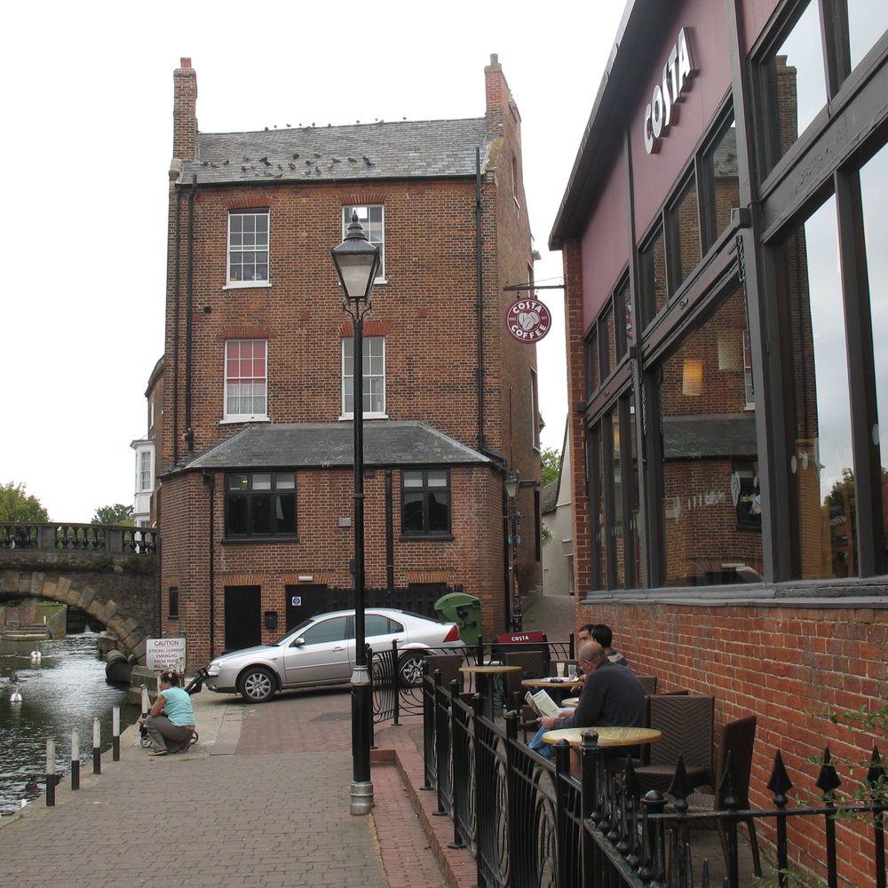 Costa - Costa Newbury, outside seating with river/canal frontage and big windows behind - Coffee & Tea Near Me - Newbury, WBK