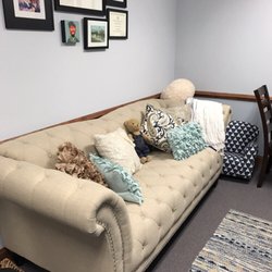 Blue Jellyfish Speech & Language - Office sofa, with local art above