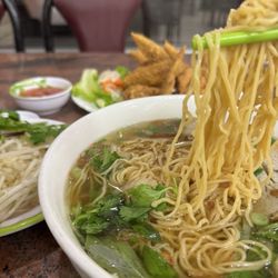 Pho Saigon City 2 - #29. Egg Noodle, Shrimp, Squids, Fish ball, fish cake, crab meat. Background: A9. Fried Chicken Wings