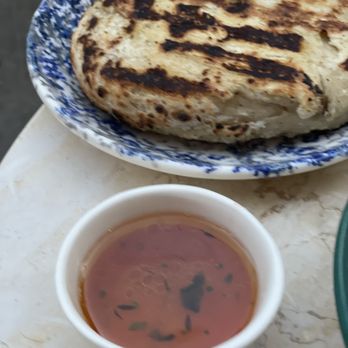 Grey Gardens - Fresh bread with tomato vinaigrette and olive oil - Wine Bars Near Me - Toronto, Ontario Grey Gardens - Fresh bread with tomato vinaigrette and olive oil - Wine Bars Near Me - Toronto, Ontario
