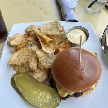 District Bar and Kitchen - Home made potato chips, aoli (spelling) sauce which also tastes good on the burger and a sliced pickle. - Bars Near Me - Ocala, Florida District Bar and Kitchen - Home made potato chips, aoli (spelling) sauce which also tastes good on the burger and a sliced pickle. - Bars Near Me - Ocala, Florida