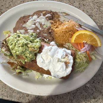 Mariscos Las Playitas - Beef chimichanga served with rice and beans. A very large plate of food. - Mexican Near Me - Avondale, Arizona