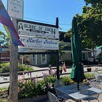 A Slice of Eden - Welcome sign with some of the many flowers bordering the patio. - Bakeries Near Me - Bar Harbor, Maine