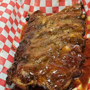Due South BBQ - Close-up of one of the 1/2 Rack of BBQ Ribs. - Southern Near Me - Roanoke, Virginia Due South BBQ - Close-up of one of the 1/2 Rack of BBQ Ribs. - Southern Near Me - Roanoke, Virginia