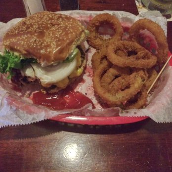 Brass Ring Pub - Bacon cheeseburger with lettuce, onion, mayo and American cheese with onion rings - Pubs Near Me - North Palm Beach, Florida