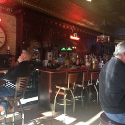 two men sitting at the bar