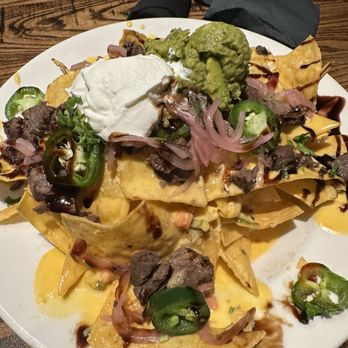 Local Goat - Steak Nachos* - New American Near Me - Pigeon Forge, Tennessee