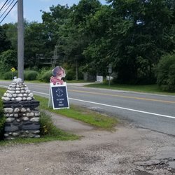 Located off the road: look for this sandwich board advertising Warwick Ice Cream!