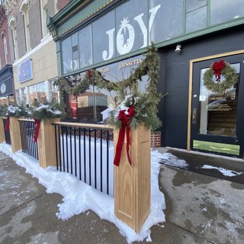 The Keeping Room - the front of a building with a christmas wreath on the railing - Desserts Near Me - Nebraska City, Nebraska