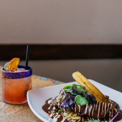 Mole Mexican Kitchen - Molé enchiladas topped with rich house-made sauce and authentic flavors at Molé Palm Desert.