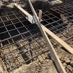 K & T Construction  - A pad that is 100% ready to pour, rebar is tied and bolts are set and at the correct elevation.