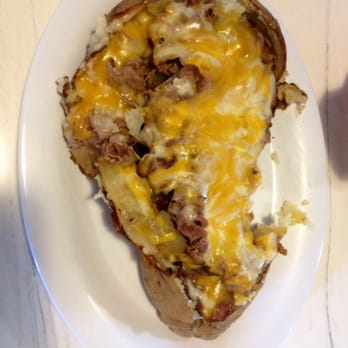 McAlister's Deli - Full sized potato! Roast beef with caramelized onions and cheese - Delis Near Me - Peoria, Illinois McAlister's Deli - Full sized potato! Roast beef with caramelized onions and cheese - Delis Near Me - Peoria, Illinois