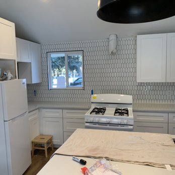 Backsplashes Plus More - a kitchen with white cabinets - Tiling Near Me Backsplashes Plus More - a kitchen with white cabinets - Tiling Near Me