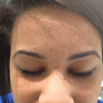 Brow Art 23 - The right brow is fuller than the left with more of a more pronounced arch=Uneven brows plus stray hair left behind = No bueno! - Hair Removal Near Me - Pensacola, Florida