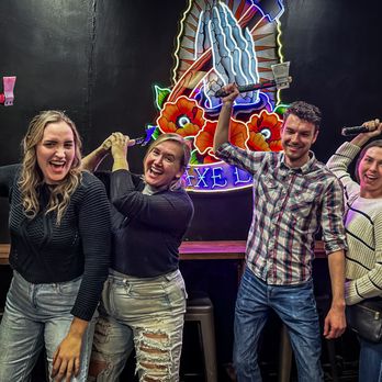 The Axe Lair - Group of friends with their hatchets - Axe Throwing Near Me - Fullerton, California