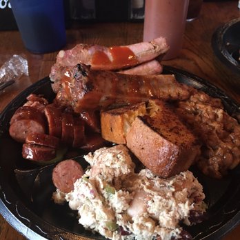 Moe's Original Bar B Que - Ribs and sausage with a side of baked beans, corn bread and chicken salad. - Barbeque Near Me - Mobile, Alabama Moe's Original Bar B Que - Ribs and sausage with a side of baked beans, corn bread and chicken salad. - Barbeque Near Me - Mobile, Alabama