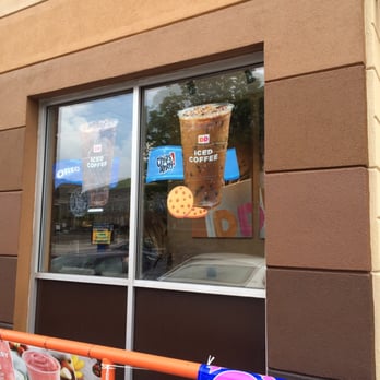Dunkin' -  the reflection of a dunkin donut in the window of a dunkin donut shop - Donuts Near Me - Baltimore, Maryland