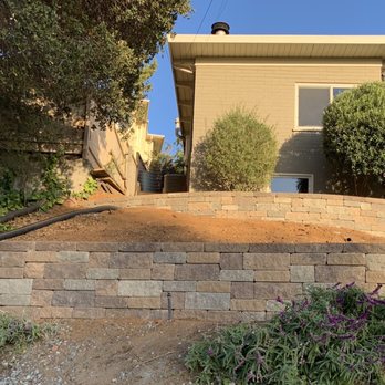 Solid Ground Masonry and Concrete - Mosaic block walls dramatically improve the yard once overrun with ivy - Masonry/Concrete Near Me