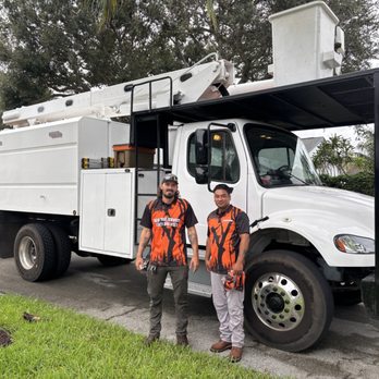 Geo Tree Service - Geo crew in front of their clean white bucket tree trimming truck. - Tree Services Near Me Geo Tree Service - Geo crew in front of their clean white bucket tree trimming truck. - Tree Services Near Me