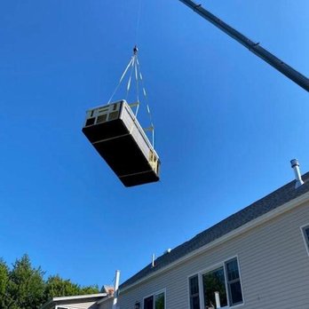 Veno Construction - a house being lifted by a crane - Septic Services Near Me Veno Construction - a house being lifted by a crane - Septic Services Near Me