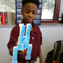 Academics-1st - Dylan balancing robot on his finger.  STEM activity