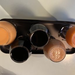 four glasses of orange juice