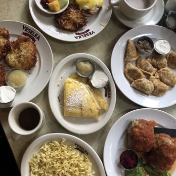 Veselka - Clockwise from the top: Eggs Benedict, short rib pierogi (fried), Stuffed Cabbage, egg noodles, Blintzes Single, and Potato Pancakes! - Ukrainian Near Me - New York, New York Veselka - Clockwise from the top: Eggs Benedict, short rib pierogi (fried), Stuffed Cabbage, egg noodles, Blintzes Single, and Potato Pancakes! - Ukrainian Near Me - New York, New York