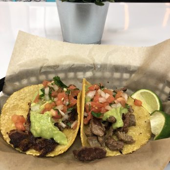 Taco Man Grill - Carnitas taco on the left, carne asada taco on right. - Mexican Near Me - Henderson, Nevada Taco Man Grill - Carnitas taco on the left, carne asada taco on right. - Mexican Near Me - Henderson, Nevada