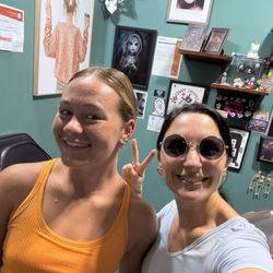 Chenoa Tattoo Company - Piercer and client