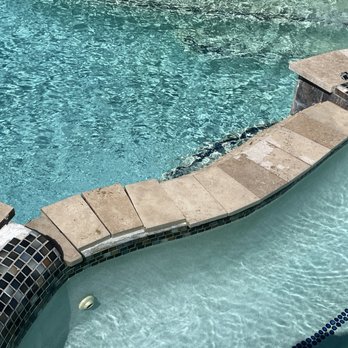 Backyard Amenities - a swimming pool with steps leading up to it - General Contractors Near Me - Baytown, Texas Backyard Amenities - a swimming pool with steps leading up to it - General Contractors Near Me - Baytown, Texas