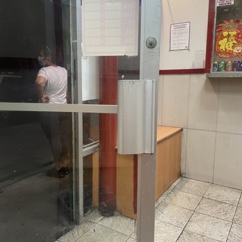 Chung Ching Restaurant - a person entering a restaurant through a glass door - Chinese Near Me - Bronx, New York Chung Ching Restaurant - a person entering a restaurant through a glass door - Chinese Near Me - Bronx, New York