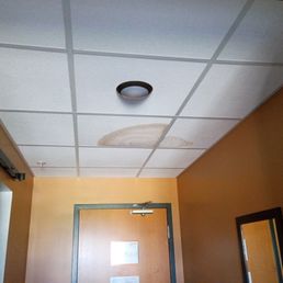 water damage stain on ceiling in our guest room