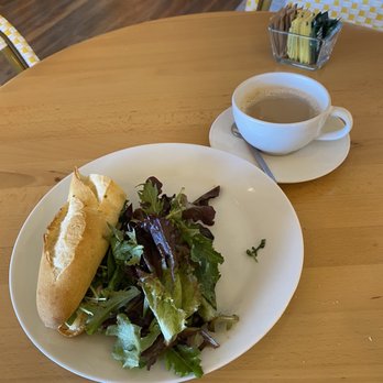 Saveurs la Boulangerie - Half Brie sandwich and cafe au lait (I ate half before I thought to take a photo) - Cafes Near Me - Austin, Texas