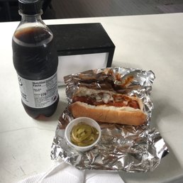 a bottle of soda and a hot dog