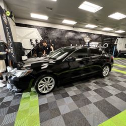 Luxury Detailing Tints and Wraps - Acura ILX applying ceramic coat.