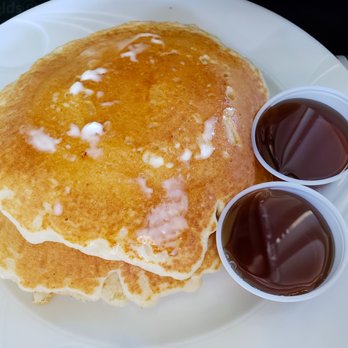 Olympia Diner - A buttery stack with glistening syrup. The syrup is probably from Vermont,  which has perhaps the finest syrup in the world. Sorry, Canada. - Diners Near Me - Newington, Connecticut