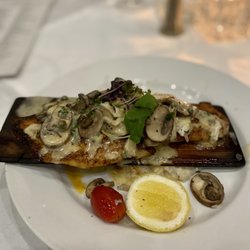 Mansurs on the Boulevard - Cedar-roasted red fish topped with crabmeat and mushrooms
