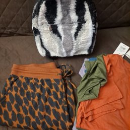 For $75 and change - Two long sleeve shirts, two short sleeve shirts, leopard joggers, and furry mini backpack.