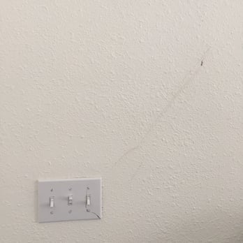 A New Beginning Monterey - Broken light switch and scratched up wall from the movers - Movers Near Me