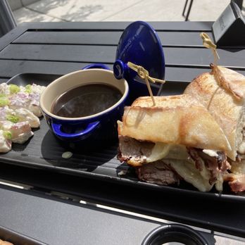 Piazza Bar - Prime rib sandwich with jus and potato salad - Pizza Near Me - Carson City, Nevada Piazza Bar - Prime rib sandwich with jus and potato salad - Pizza Near Me - Carson City, Nevada