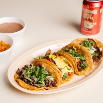 Lucido's Tacos - a plate of tacos and a can of soda - Mexican Near Me - Chicago, Illinois
