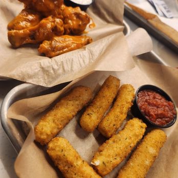 Buffalo Wild Wings - two baskets of buffalo wings and dipping sauce - Sports Bars Near Me - North Charleston, South Carolina