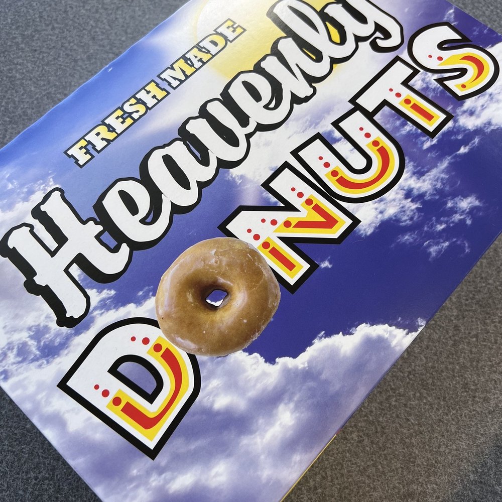 a glazed donut on a sign