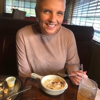 Captain Joe's Seafood - a woman sitting at a table with a bowl of food - Seafood Near Me - Waycross, Georgia