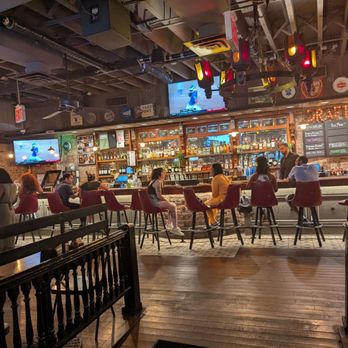 Dinosaur Bar-B-Que - Bar Area with TV screens tuned to sports - Barbeque Near Me - New York, New York Dinosaur Bar-B-Que - Bar Area with TV screens tuned to sports - Barbeque Near Me - New York, New York